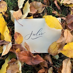 "Julie" written in modern calligraphy on an envelope