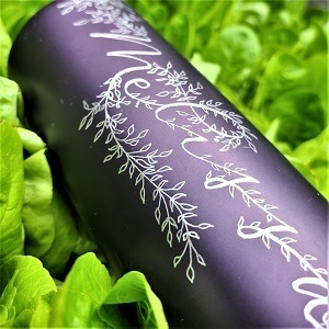 Engraved water bottle: "Melissa" in modern calligraphy with leaf design