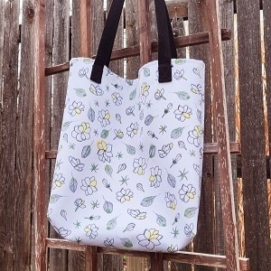 A tote bag made out of an illustrated sampaguita pattern